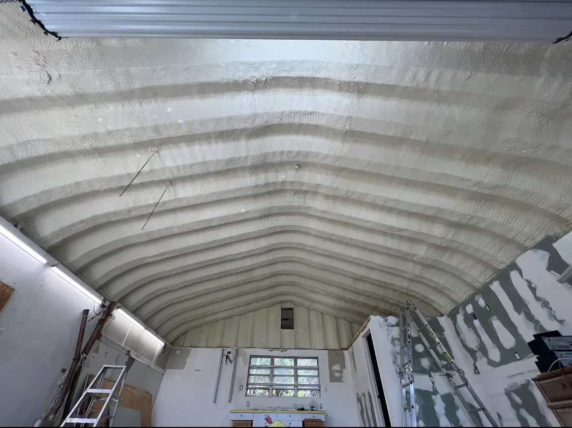 Spray polyurethane foam applied to the underside of a metal roof deck in Lindenhurst